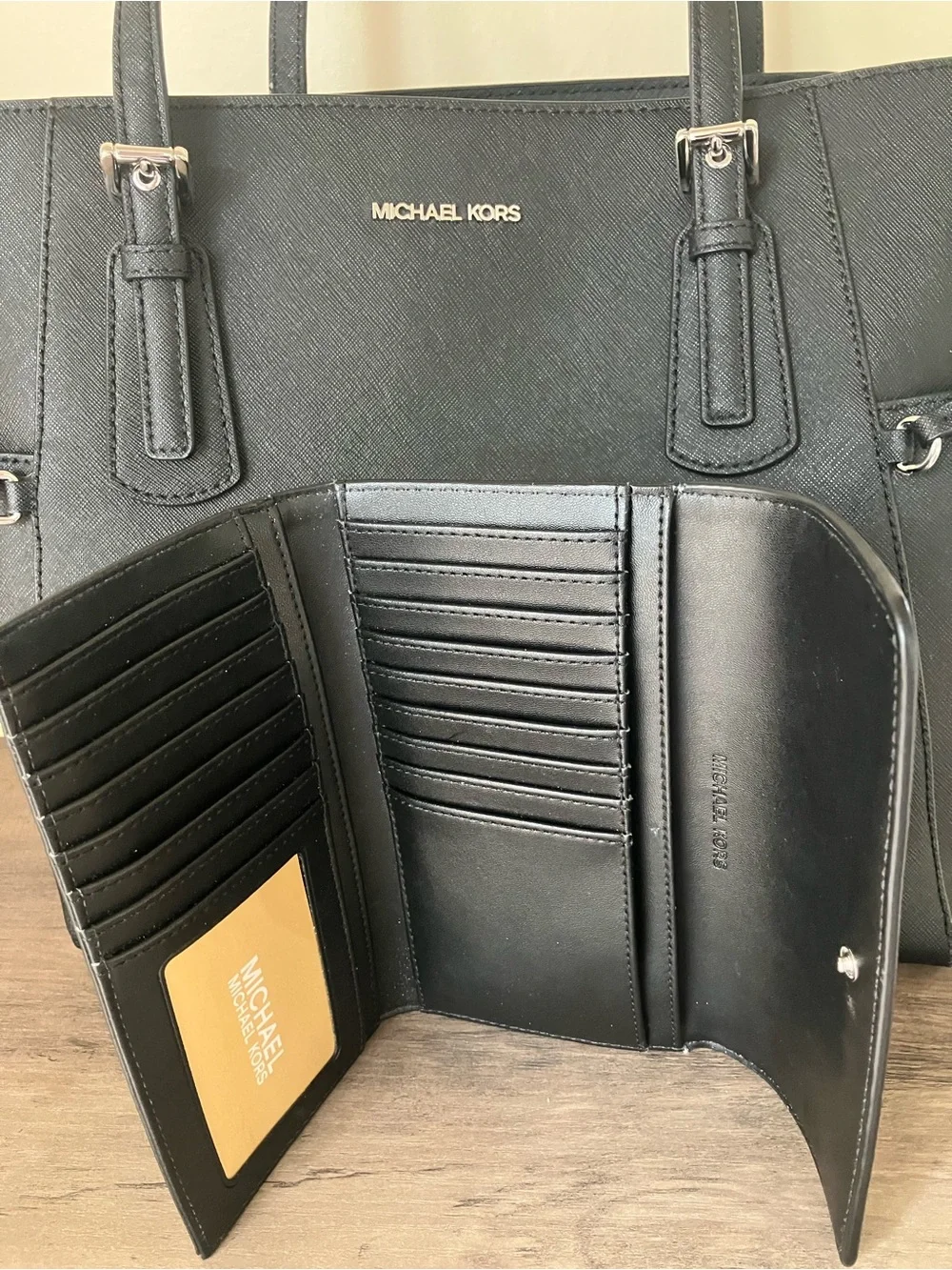 Michael Kors Black Saffiano Tote with Double Straps and matching wallet.